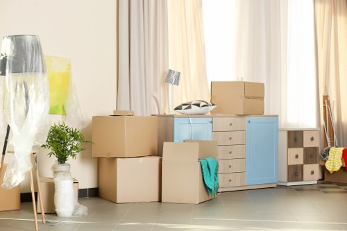 Movers team carefully preparing furniture for a safe relocation
