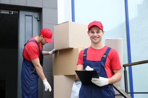 Removal team handling boxes and household items
