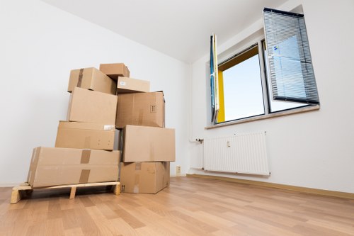 Careful lifting of furniture during a flat move in Brixton