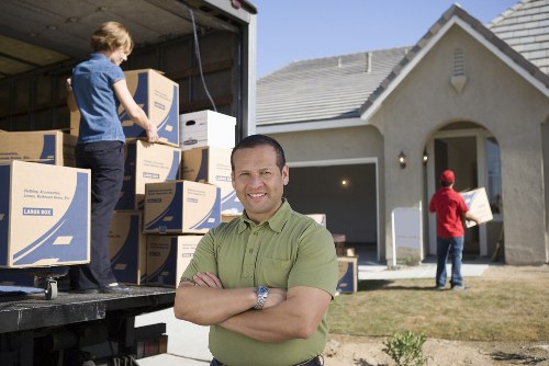 Removal crew loading business items during a Brixton relocation