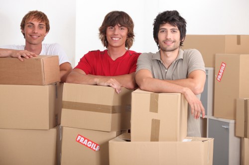 Packed office boxes and protected furniture ready for transport