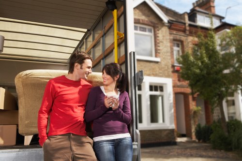 Loading furniture into a van in a Brixton residential street