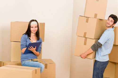 Staff using proper lifting techniques during a move